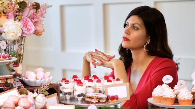 Image for article titled Single Woman Seated At Wedding’s Dessert Table