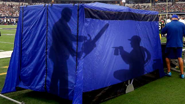 Image for article titled Silhouette Of Chainsaw, Blowtorch Visible Through NFL Injury Tent