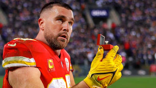 Image for article titled Travis Kelce Gets Down On One Knee At Midfield And Proposes To Reba McEntire